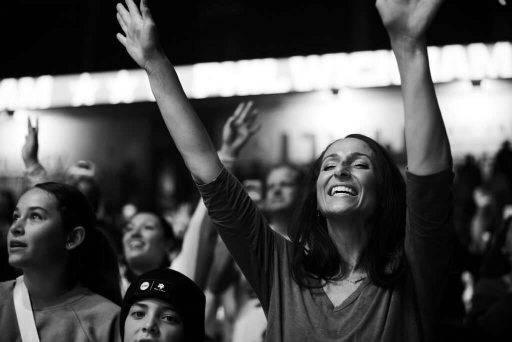 woman worships at harvest crusade hope for america in utah