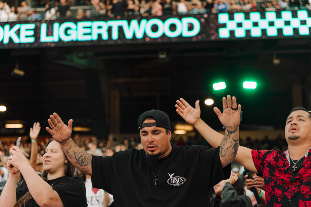 man worshipping at the 2025 harvest crusade