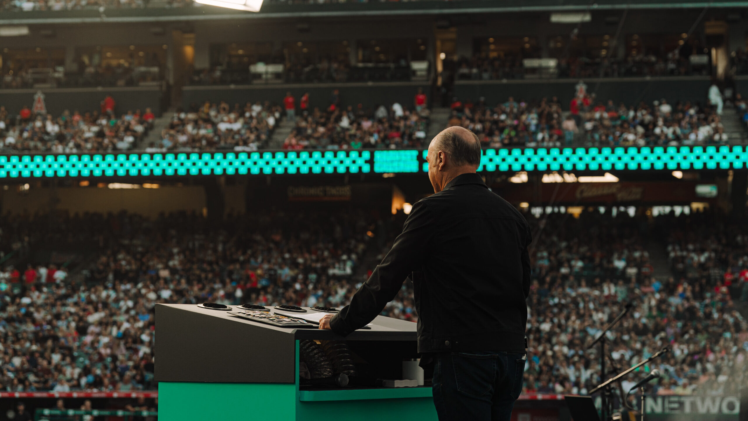 Greg Laurie on stage at Angel Stadium for the Harvest Crusade