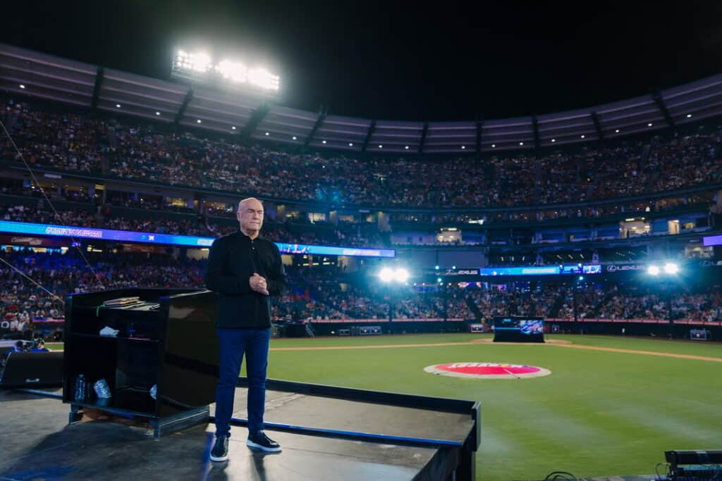 Greg Laurie on stage at Angel Stadium for the 2024 Harvest Crusade