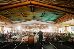 Greg Laurie staring at crowd on stage at Hope For Lahaina event in Maui