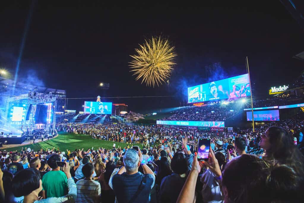 People on the field at Angel Stadium for the 2024 Harvest Crusade making professions of faith