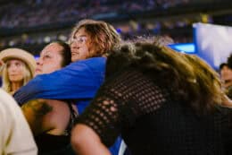 woman and daughter together crying at angel stadium for harvest crusade 2024