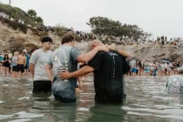 Jonathan Laurie baptizing at the 2024 Pirate's Cove Jesus Revolution Baptism