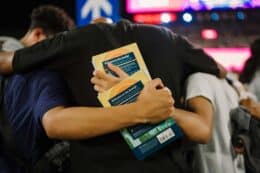 new believer's bible being carried at 2024 harvest crusade at angel stadium