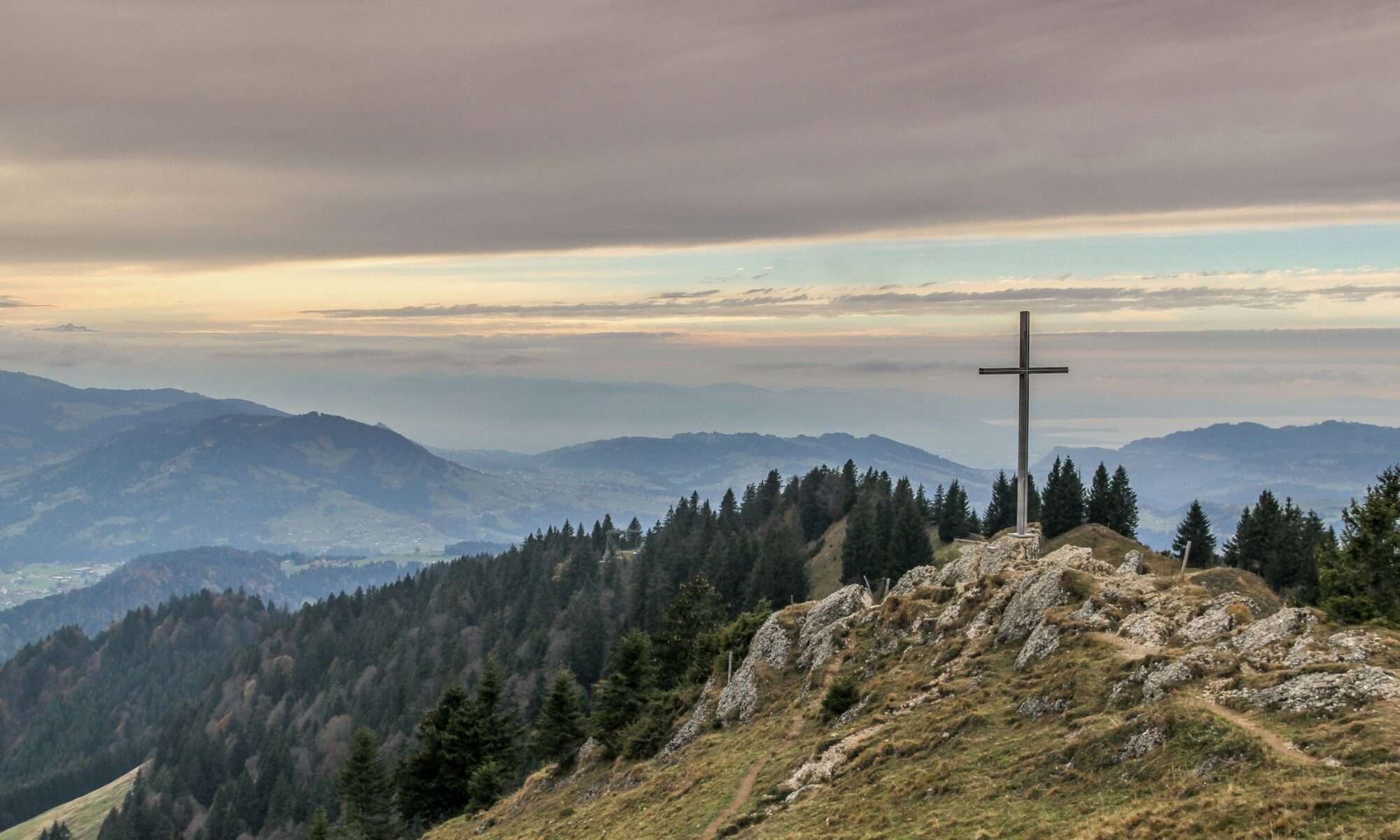 Cross sitting on mountain